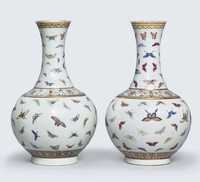 IRON-RED GUANGXU SIX-CHARACTER MARKS AND OF THE PERIOD (1875-1908) A PAIR OF FAMILLE ROSE ‘BUTTERFLY’ BOTTLE VASES